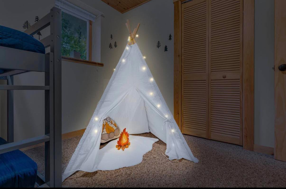 Kids’ bunk room with a cozy teepee